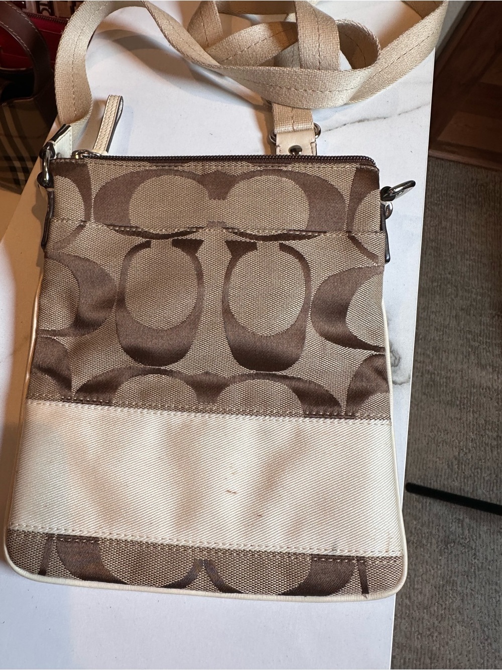 Coach signature canvas crossbody bag tan